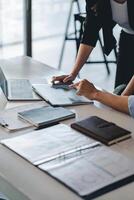Business People Talking Discussing with coworker planning analyzing financial document data charts and graphs in Meeting and successful teamwork Concept photo