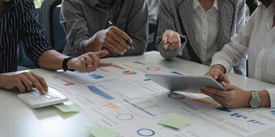 Financial,accounting, investment advisor consulting with her team at office. Teamwork Meeting Concept photo