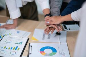 Business people teamwork stack touch arms palms together celebrating promotion reward, succeed common aim. give high five symbol of unity photo