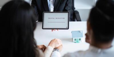Close-up of female hand signing e-document with on tablet. Electronic signature and modern technologies concept photo