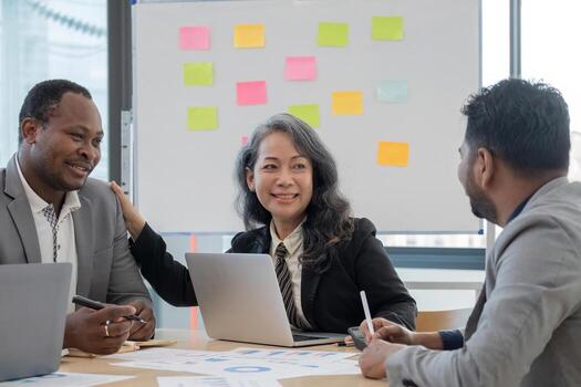 Diverse team different and data with sales strategy at office. Talk, collaboration and teamwork with brainstorming and paperwork analysis of finance with statistics photo