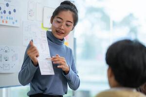 Ux developer and ui designer use augmented reality brainstorming about mobile app interface wireframe design on desk at modern office. creative digital development agency photo