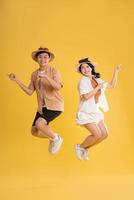 Portrait image of couple posing on yellow background, summer, travel photo