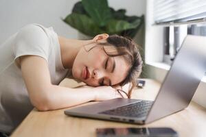 Portrait of asian girl working at home photo