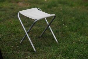 Folding Camping Chair Standing on Grass photo