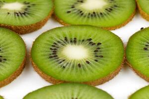 Sliced kiwi. Kiwi texture or background. Freshly sliced kiwi on a white background photo