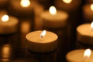 Many burning candles with shallow depth of field. candles in memory of the dead photo