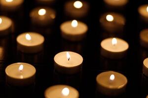Many burning candles with shallow depth of field. photo
