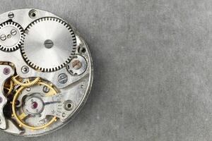 clock mechanism close-up. Inside the clock. close up of cogwheels in clockwork photo