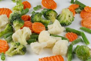 Frozen vegetables close-up on a white background. photo