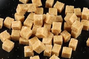 Brown cane sugar in cubes photo