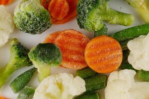 Frozen vegetables close-up on a white background. photo