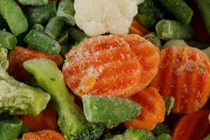 Frozen vegetables close-up. Vegetables in the fridge photo