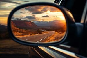 a zoomed or close-up image of a car front mirror with a beautiful view of Landscapes photo