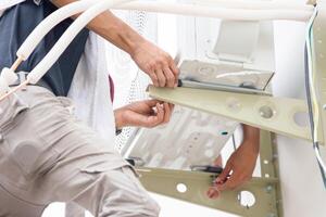 Repairman service for repair and maintenance of air conditioners, Technician team install new air conditioning photo