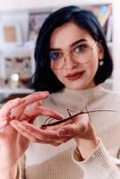 Young Woman Captured in a Beautiful Moment with Her Stick Insect , Medauroidea Extradentata photo