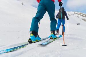 Close-Up of Ski Gear Ready for a Challenging Ascent photo