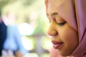 Close up Portrait of a Joyful Middle Eastern Hijabi photo