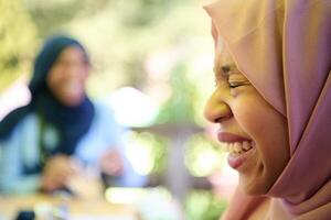 Close up Portrait of a Joyful Middle Eastern Hijabi photo