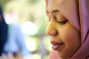 Close up Portrait of a Joyful Middle Eastern Hijabi photo
