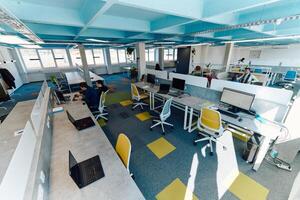 Photo of a modern office where programming, digital marketing and web design projects are done. Office with modern furniture and glass office
