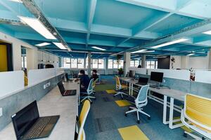 Photo of a modern office where programming, digital marketing and web design projects are done. Office with modern furniture and glass office