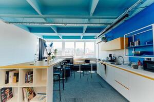 Photo of a modern office where programming, digital marketing and web design projects are done. Office with modern furniture and glass office