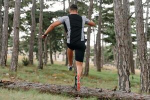 Determined Man Conquering Forest Obstacles with Grit and Speed photo