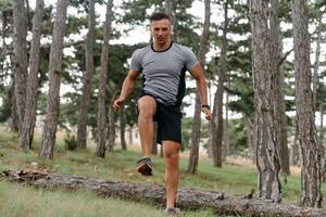 Determined Man Conquering Forest Obstacles with Grit and Speed photo