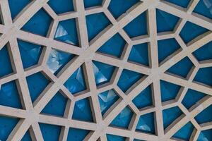 Architectural detail texture background with oriental hexagonal grid pattern photo