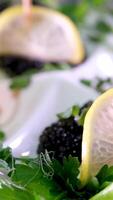 Rich live deviled eggs Luxury Hotel Red and black caviar on a plate spins on a buffet tray in the shape of a boat in lemon video