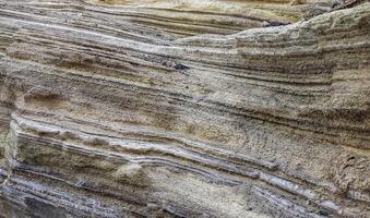 Piled up geological rock formations on the beach of Tenerife. photo