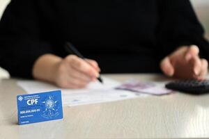 KYIV, UKRAINE - OCTOBER 31, 2023 Blue CPF card document template. The document guarantees authenticity and integrity in electronic communication between people in Brazil photo