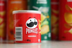 KYIV, UKRAINE - FEBRUARY 27, 2024 Pringles original potato chips on white background photo