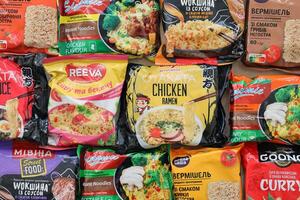 KYIV, UKRAINE - OCTOBER 31, 2023 Many packs of instant noodles for fast cooking by various brands and manufacturers photo