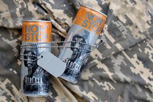 KYIV, UKRAINE - OCTOBER 31, 2023 Non Stop energy drink with limited edition design of Stalker and character with gas mask on aluminium tin can photo