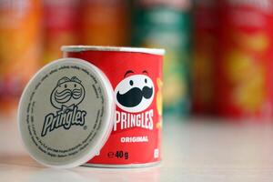 KYIV, UKRAINE - FEBRUARY 27, 2024 Pringles original potato chips on white background photo