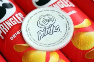KYIV, UKRAINE - FEBRUARY 27, 2024 Pringles original potato chips on white background photo