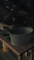A wooden table with a bucket on top video