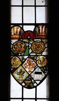 Stained Glass Window Featuring A Coat Of Arms With A Griffin, Roses, And Fleur-De-Lis In A Church In Ireland photo