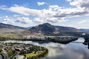 Aerial View of Kamloops, British Columbia, Showing Thompson River and Mount Paul on a Sunny Summer Day photo