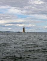 A Distant View of the Ram Island Ledge Light Station on a Cloudy Day photo