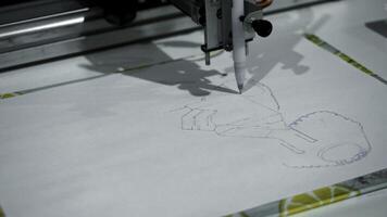 Automated machine draws image on paper. Media. Robotic machine that draws pictures with pencil. Artificial intelligence drawing with pencil photo