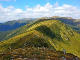 Scenic view of a mountain range on a bright summer day photo