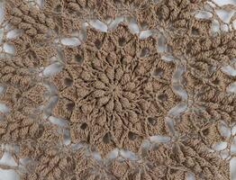 Knitted mandala in a circular frame photo