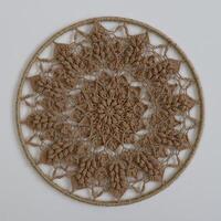 Knitted mandala in a circular frame photo