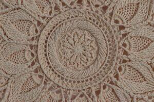 Knitted mandala in a circular frame photo