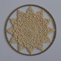 Knitted mandala in a circular frame photo