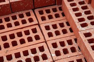 Stacked bricks ready for construction, symbolizing progress and development in the building industry. photo
