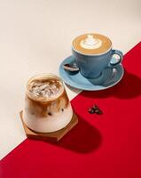 A cup of cold latte coffee and hot latte coffee on a red and white background photo